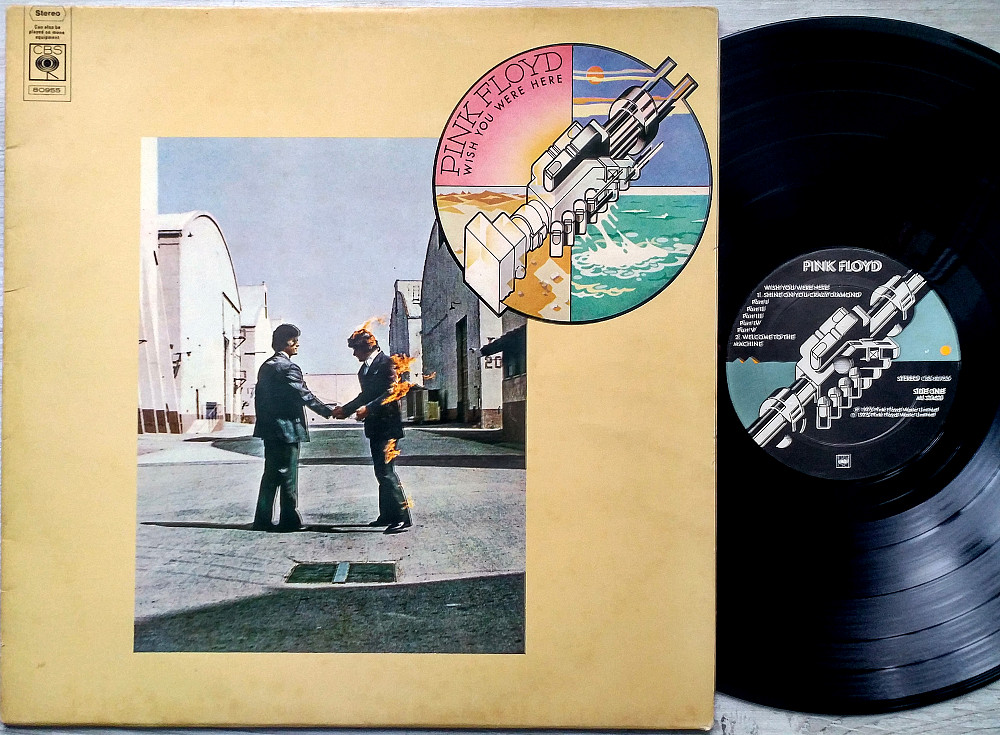 Pink floyd wish you were here перевод. Обложка Пинк Флойд 1975. Pink Floyd Wish you were here винил. Pink Floyd 1975 альбомы обложки. Пинк Флойд Wish you were here.