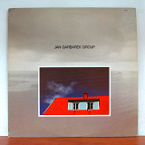 Jan Garbarek Group – Photo With Blue Sky, White Cloud, Wires, Windows And A Red Roof