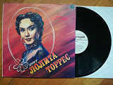 Поет Лолита Торрес-NM, Мелодія