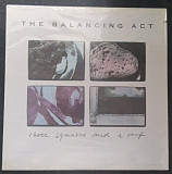 The Balancing Act – Three Squares And A Roof