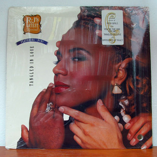 R.J.'s Latest Arrival – Tangled In Love